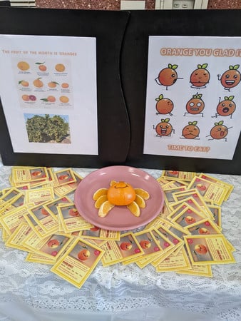 Orange fruit cards and crab display