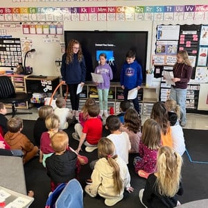 Group of students from Leadership council address a classroom of students