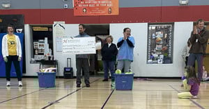 Mr. Ellenbecker delivers large check to elementary teachers for Brainball boost project as part of Grode Educational Excellence Grant
