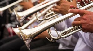 Three trumpets being played